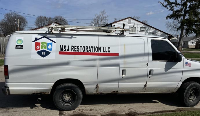 M&J Restoration service van